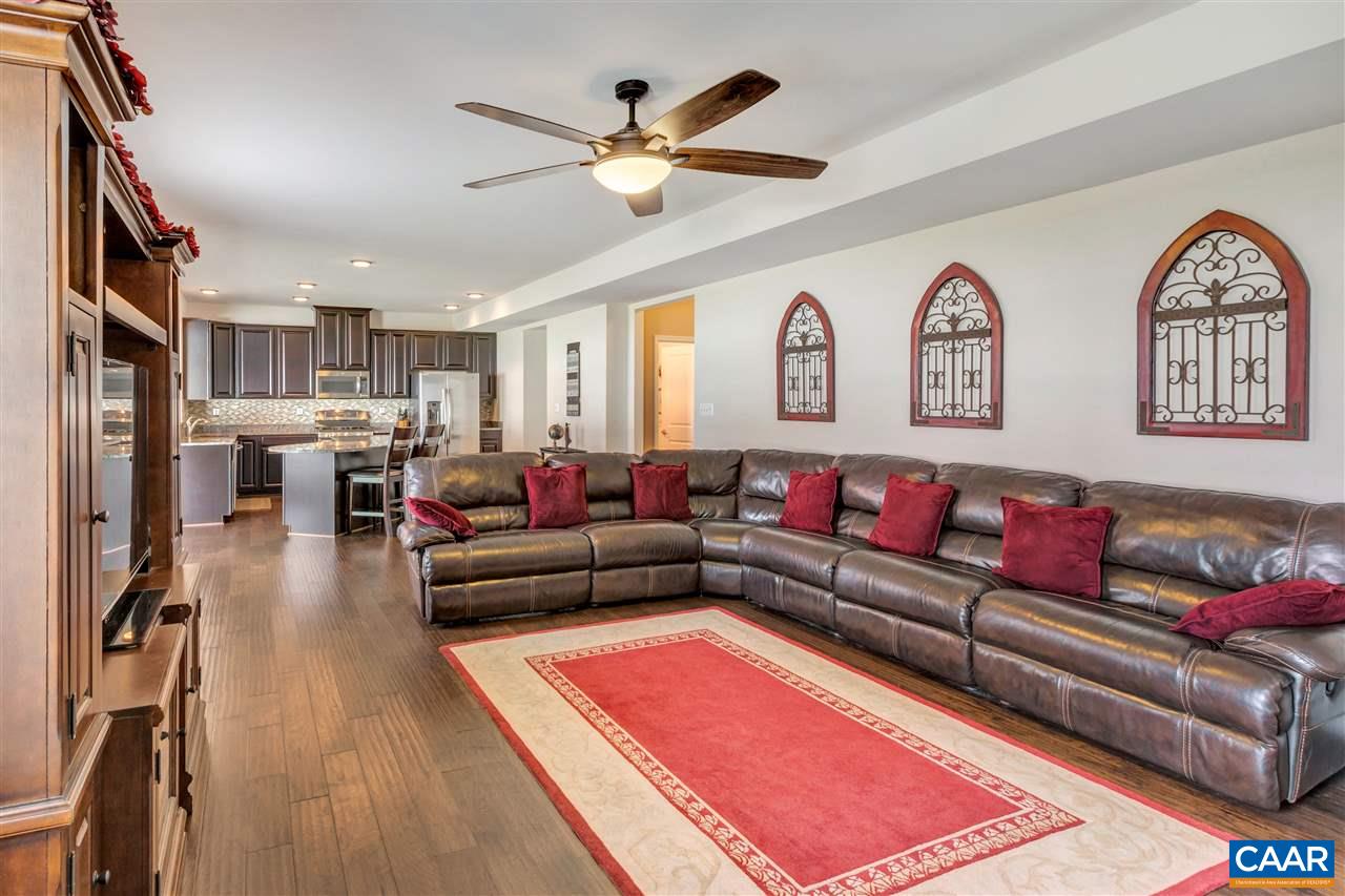 365 Ridgemont Road Ruckersville, VA 22968 - Photo 18 of 50 a living room with furniture kitchen view and a chandelier
