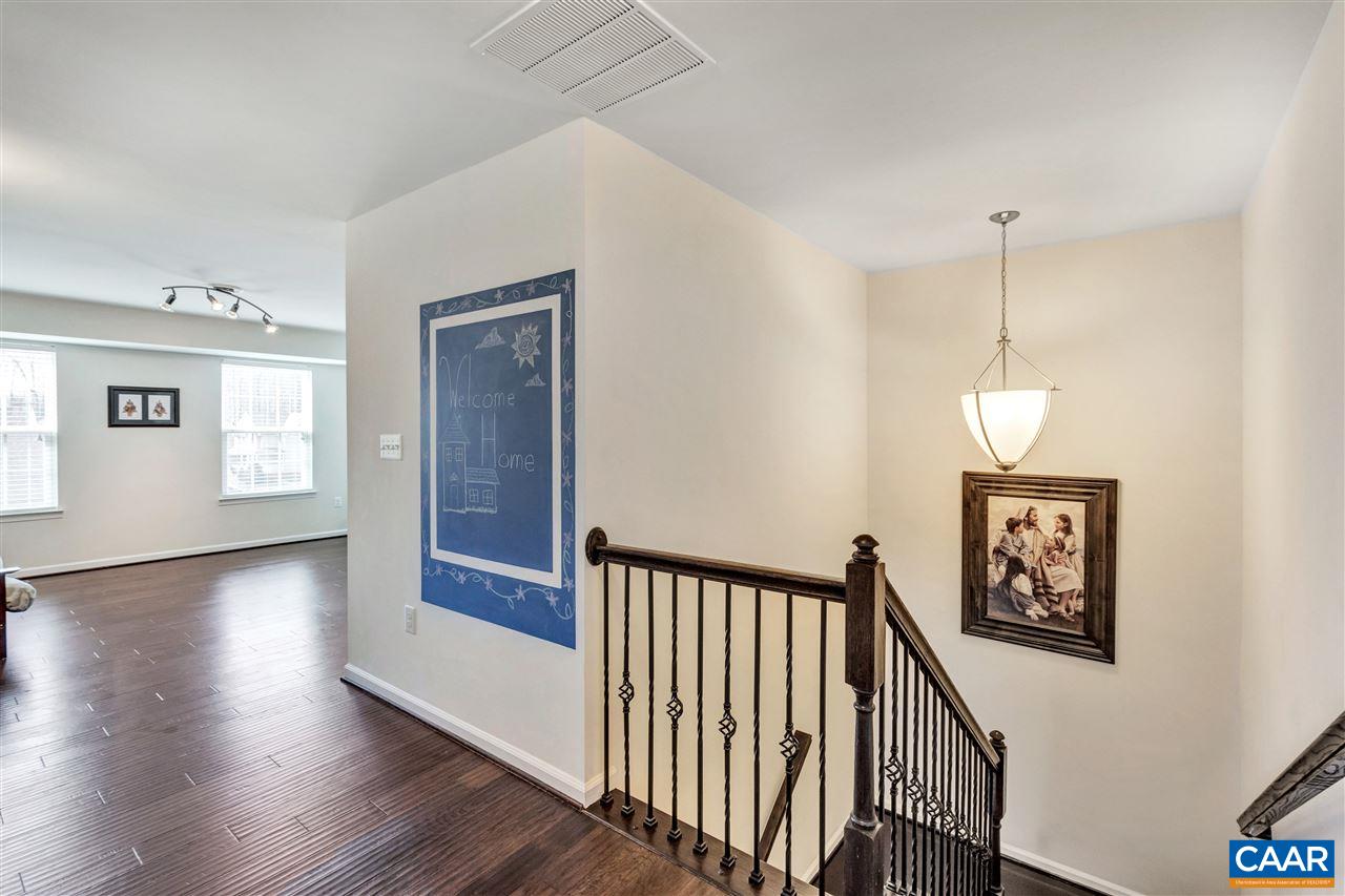 365 Ridgemont Road Ruckersville, VA 22968 - Photo 20 of 50 a view of a hallway with wooden floor and stairs