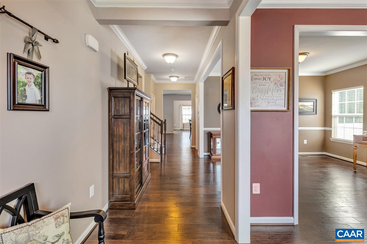 365 Ridgemont Road Ruckersville, VA 22968 - Photo 3 of 50 a hallway and a livingroom with furniture stairs