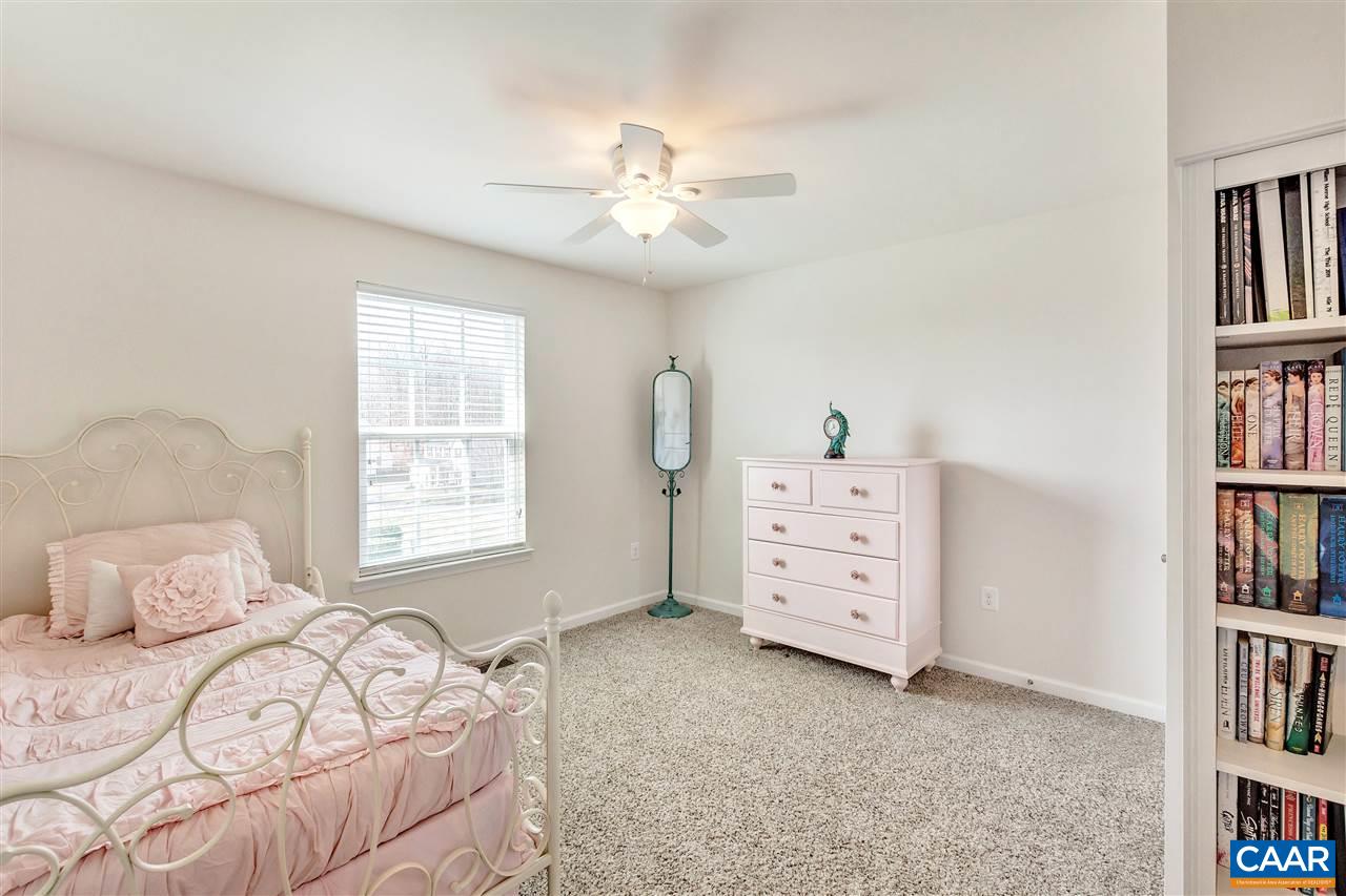 365 Ridgemont Road Ruckersville, VA 22968 - Photo 31 of 50 a bedroom with a bed and a book shelf
