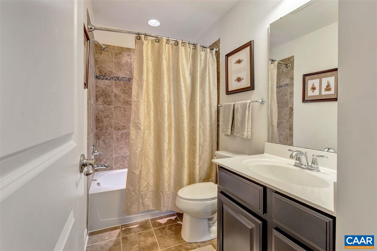 365 Ridgemont Road Ruckersville, VA 22968 - Photo 40 of 50 a bathroom with a granite countertop sink toilet and shower