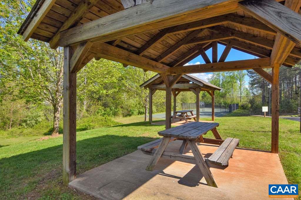 365 Ridgemont Road Ruckersville, VA 22968 - Photo 49 of 50 a view of a yard with a table and chairs in patio
