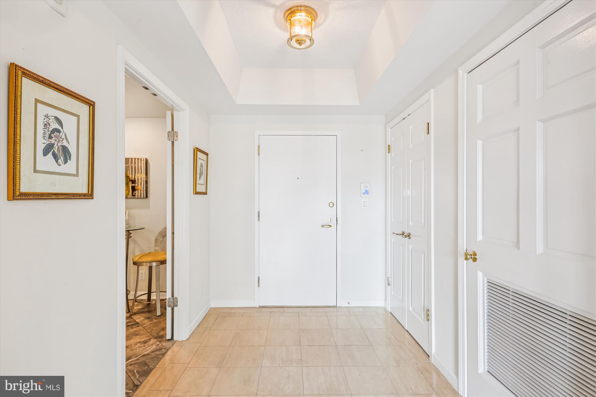 a view of an entryway with wooden floor