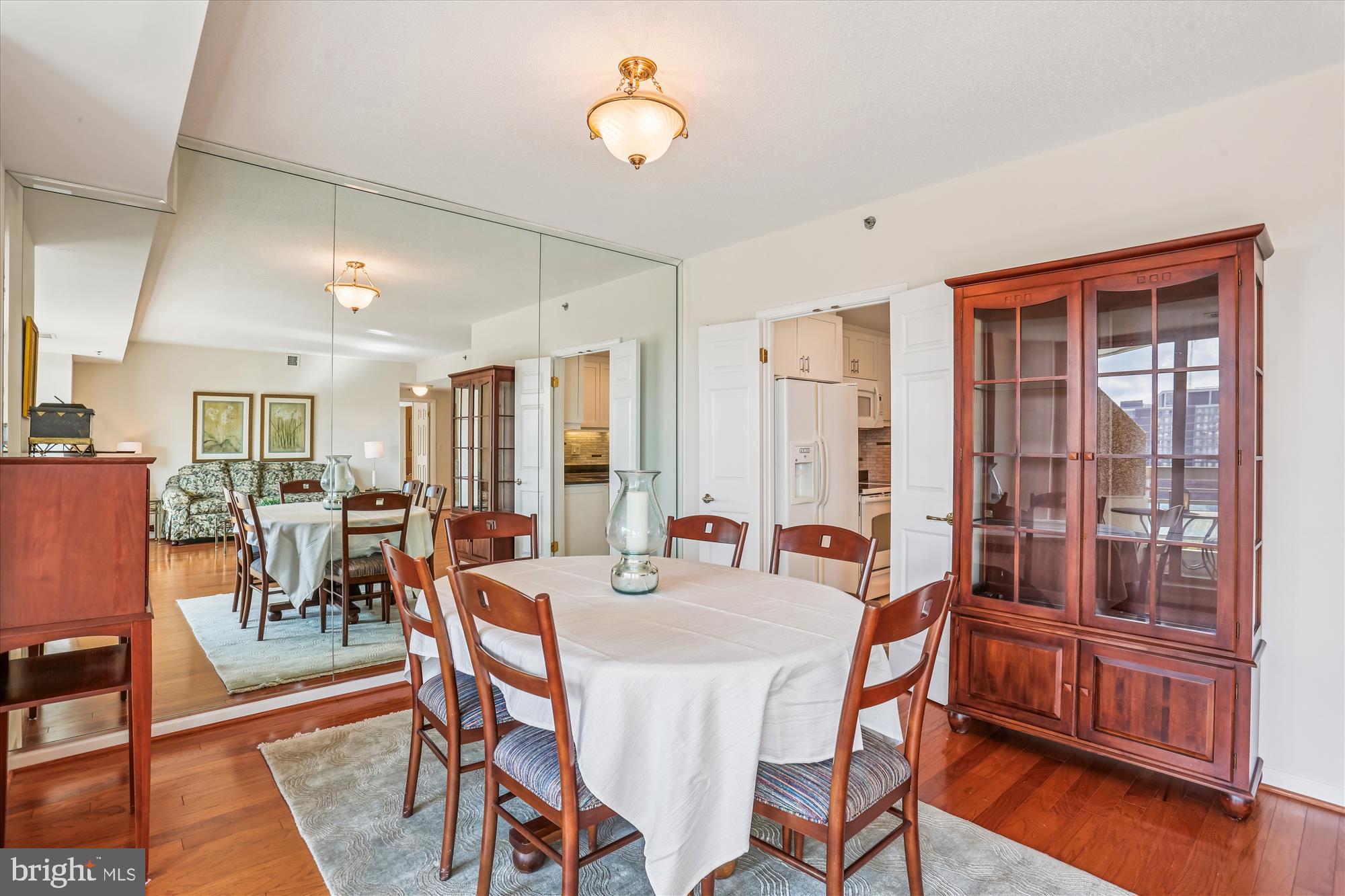 5600 Wisconsin Avenue, Unit 1105 Chevy Chase, MD 20815 - Photo 11 of 67 a view of a dining room with furniture window and wooden floor