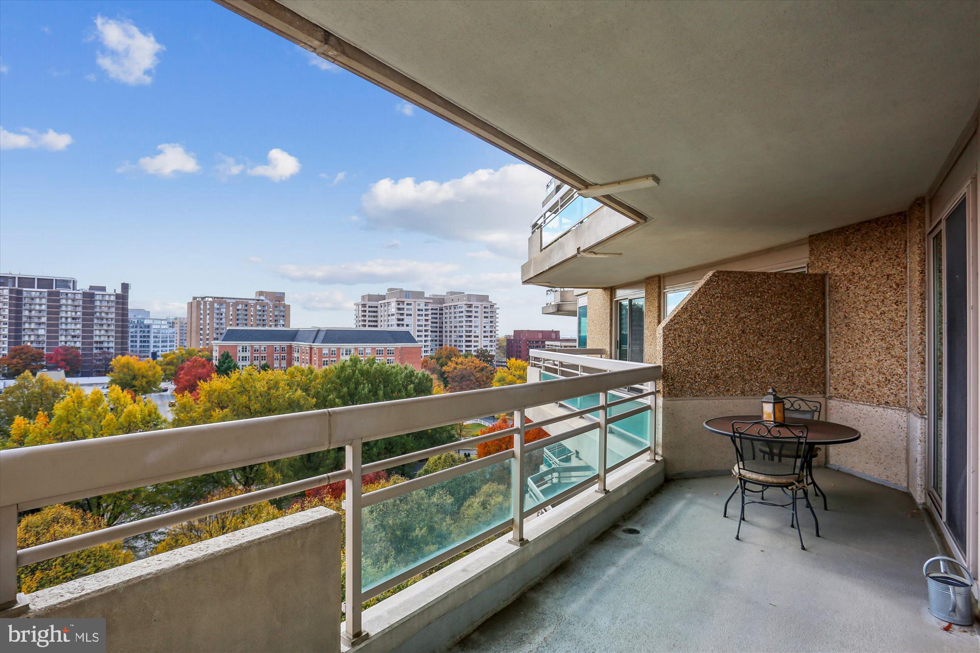 5600 Wisconsin Avenue, Unit 1105 Chevy Chase, MD 20815 - Photo 12 of 67 a view of a chairs and table in a balcony