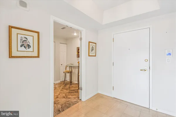 a view of a hallway with washer and dryer