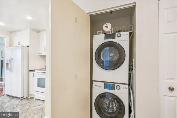 a kitchen with a stove cabinets and a refrigerator