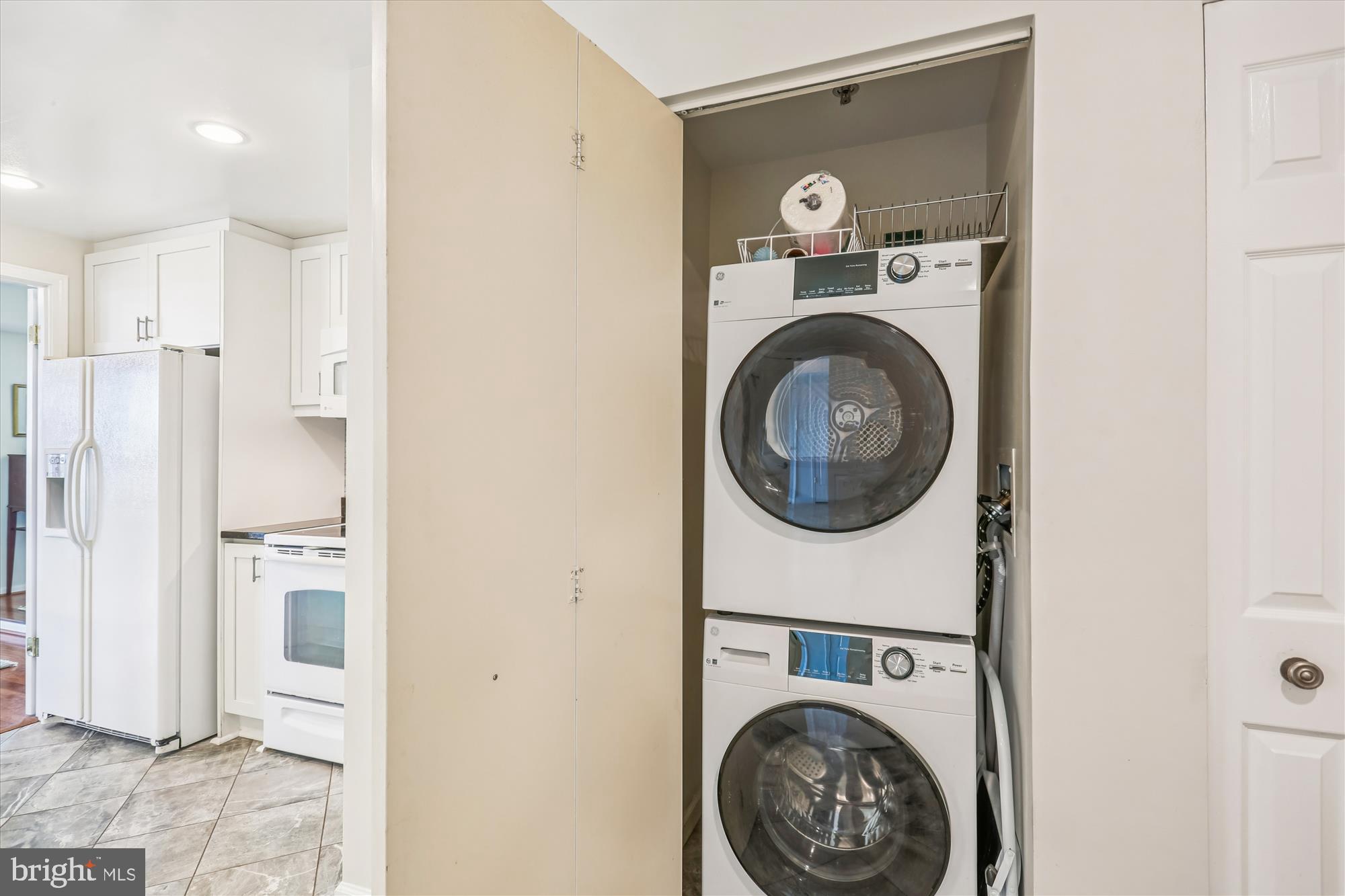 5600 Wisconsin Avenue, Unit 1105 Chevy Chase, MD 20815 - Photo 16 of 67 a view of a hallway with washer and dryer