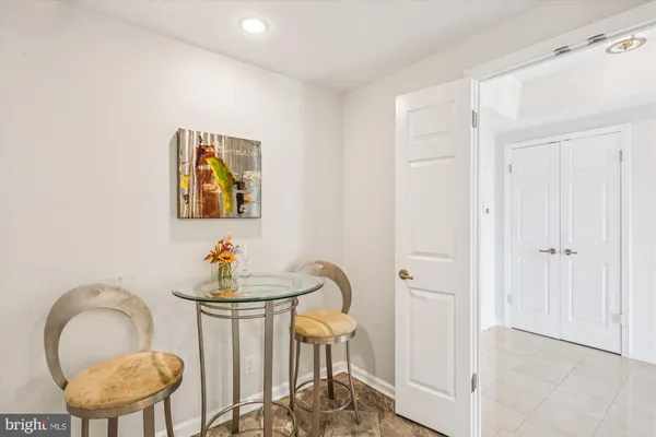 a kitchen with cabinets stainless steel appliances and a counter space