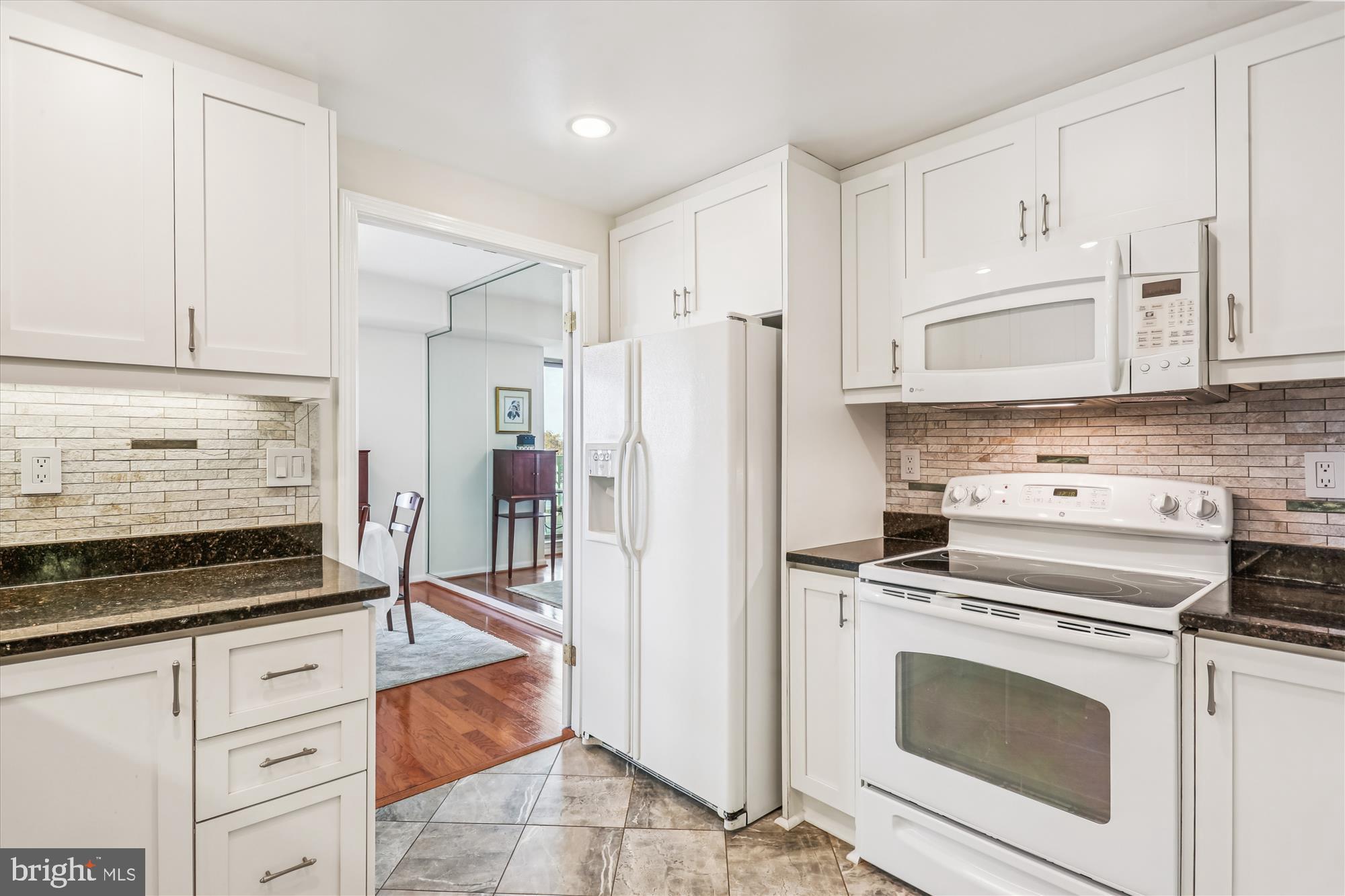 5600 Wisconsin Avenue, Unit 1105 Chevy Chase, MD 20815 - Photo 20 of 67 a kitchen with cabinets stainless steel appliances and a counter space