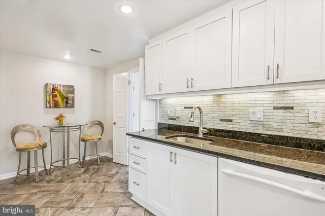 a bedroom with a bed and a night stand