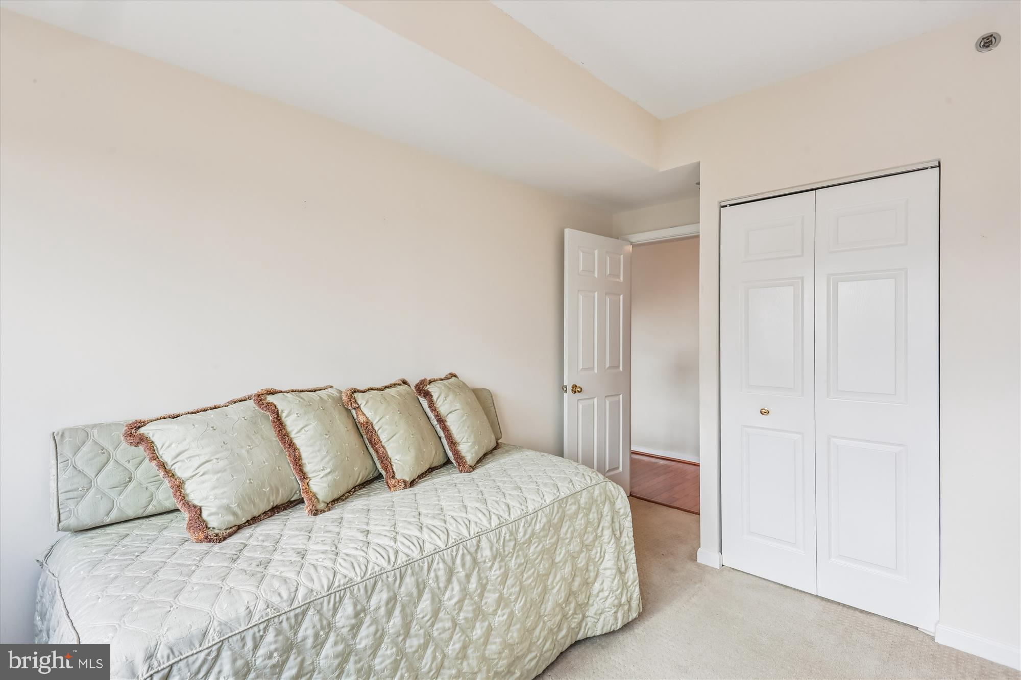5600 Wisconsin Avenue, Unit 1105 Chevy Chase, MD 20815 - Photo 26 of 67 a bedroom with a bed and a night stand