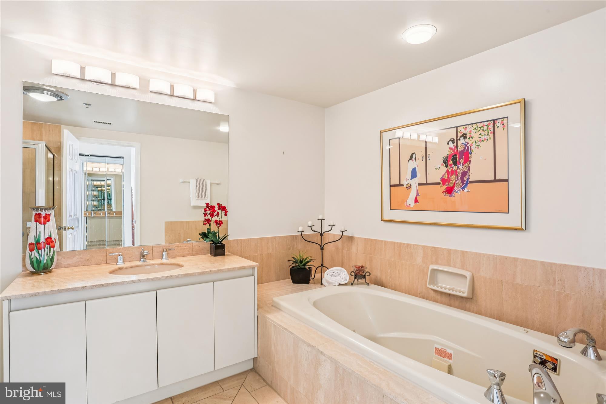 5600 Wisconsin Avenue, Unit 1105 Chevy Chase, MD 20815 - Photo 30 of 67 a bathroom with a double vanity sink mirror and bathtub