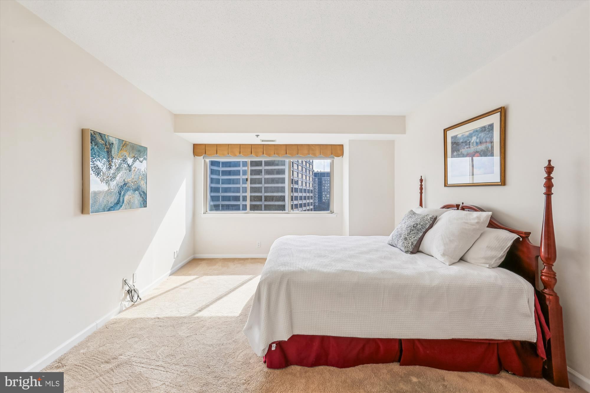 5600 Wisconsin Avenue, Unit 1105 Chevy Chase, MD 20815 - Photo 37 of 67 a bedroom with a large bed and a window