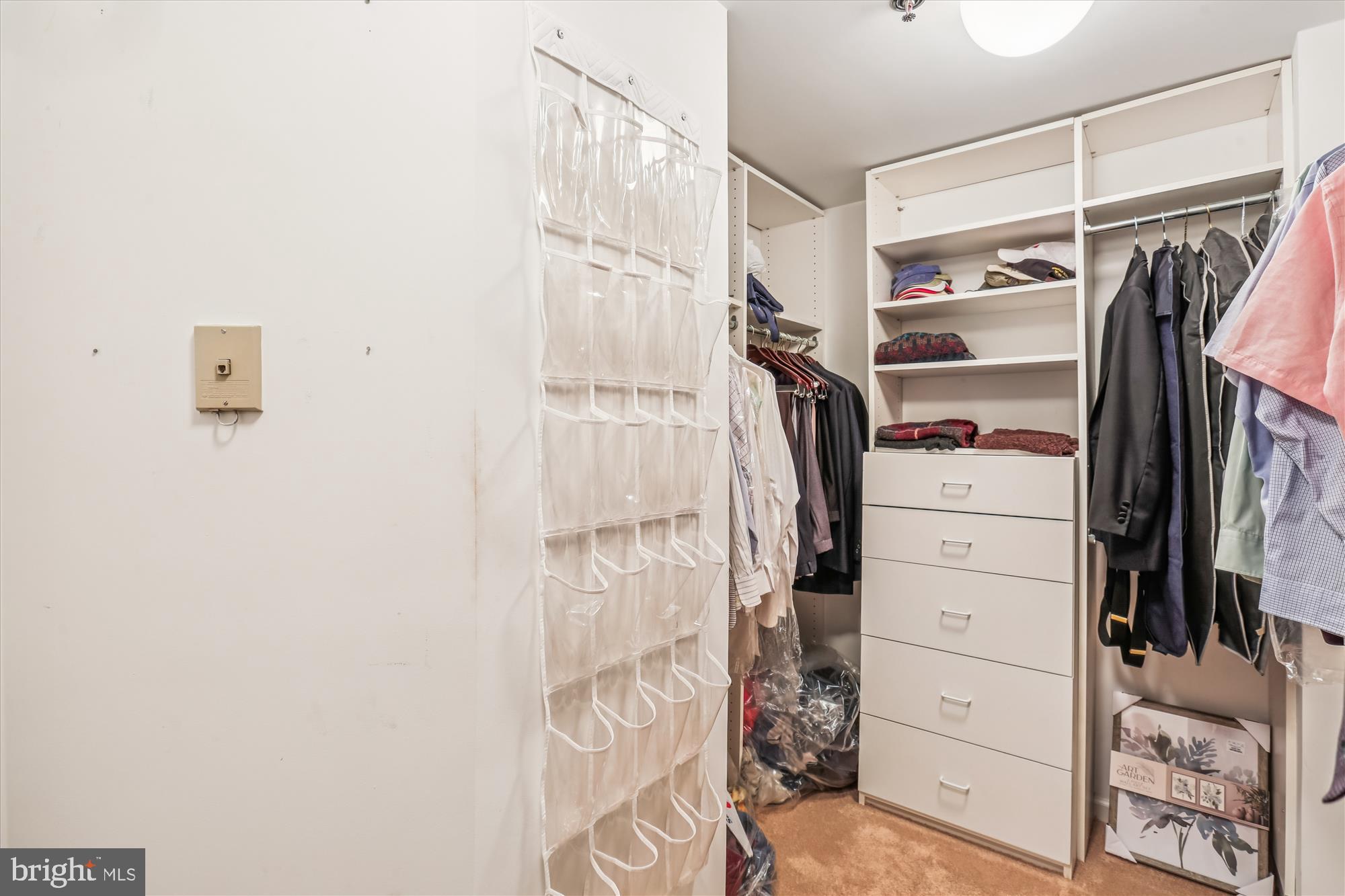 5600 Wisconsin Avenue, Unit 1105 Chevy Chase, MD 20815 - Photo 39 of 67 a view of walk in closet with clothes and shoes