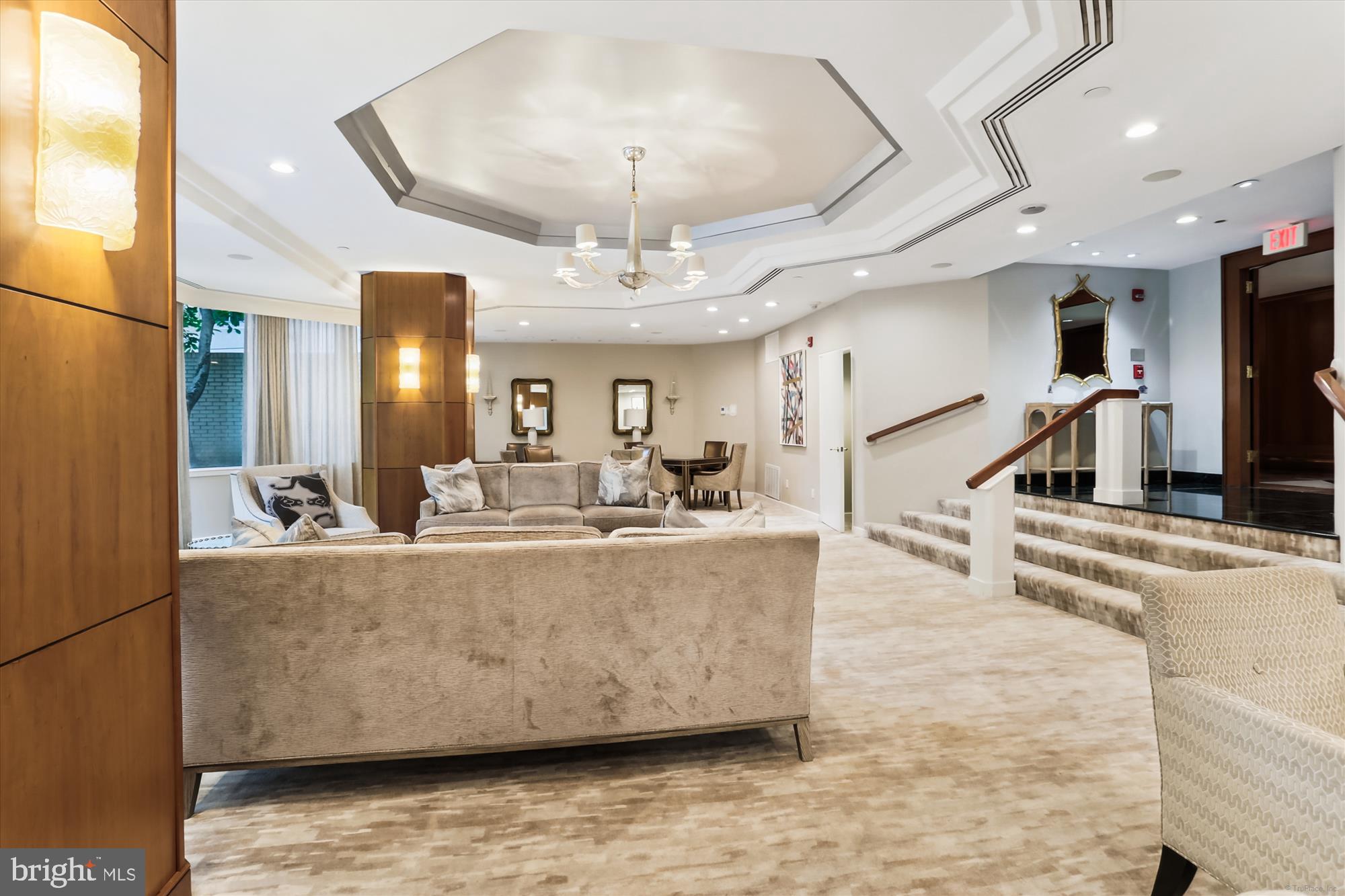 5600 Wisconsin Avenue, Unit 1105 Chevy Chase, MD 20815 - Photo 52 of 67 a living room with fireplace furniture and a view of kitchen