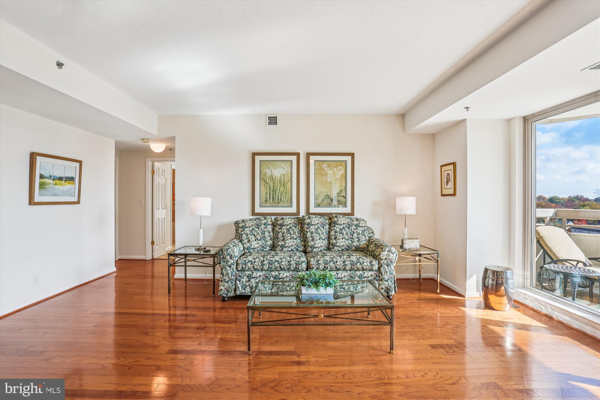 5600 Wisconsin Avenue, Unit 1105 Chevy Chase, MD 20815 - Photo 7 of 67 a living room with furniture and a floor to ceiling window