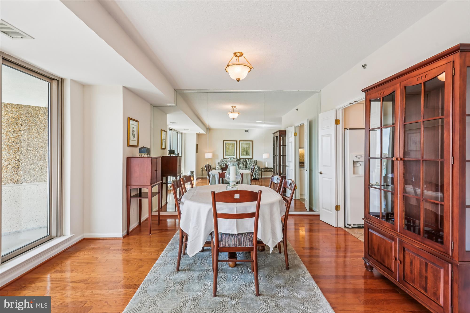 5600 Wisconsin Avenue, Unit 1105 Chevy Chase, MD 20815 - Photo 9 of 67 a dining room with furniture and a chandelier