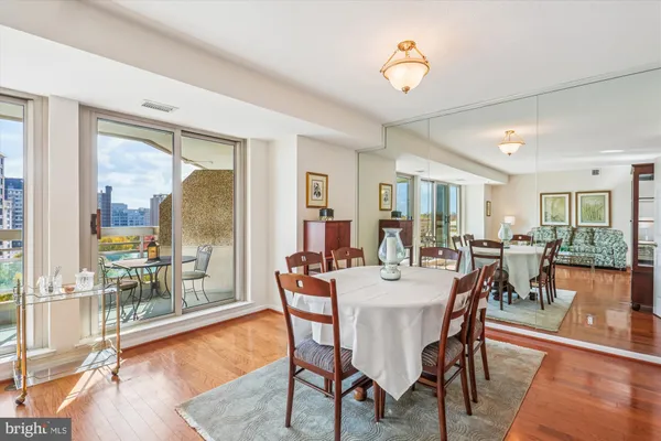 a view of a chairs and table in a balcony