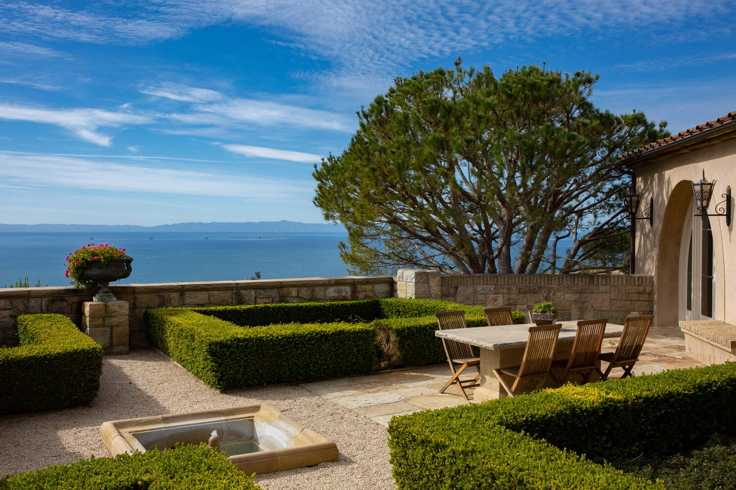 550 Freehaven Drive Montecito, CA 93108 - Photo 12 of 38 a roof deck with table and chairs a barbeque and potted plants