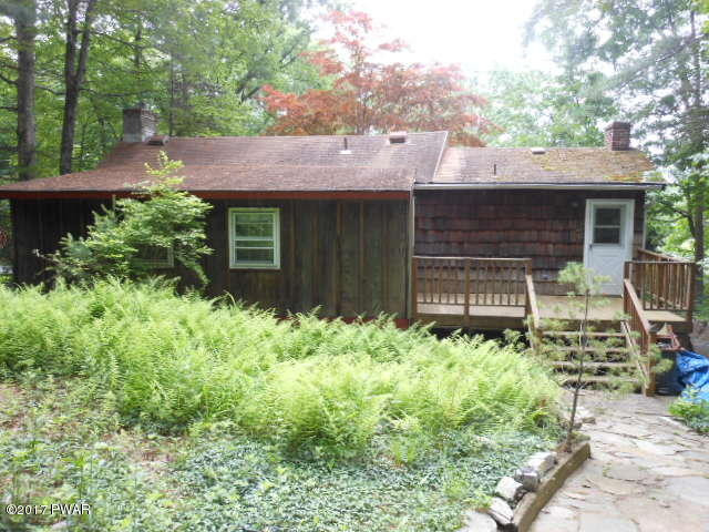 207 Aspen Road Dingmans Ferry, PA 18328 - Photo 4 of 22 a front view of a house with garden