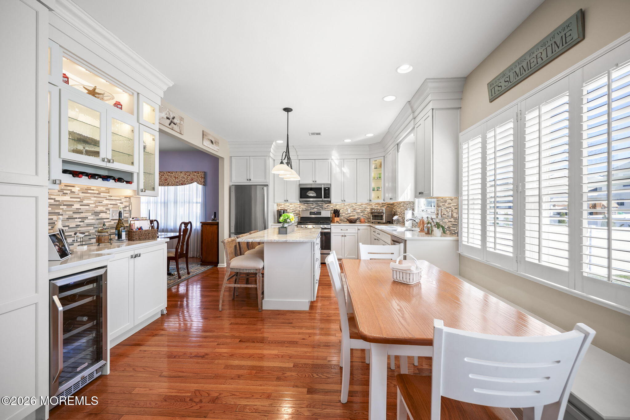 1726 M Street Wall, NJ 07719 - Photo 12 of 49 a dining room with stainless steel appliances granite countertop furniture wooden floor and a kitchen view