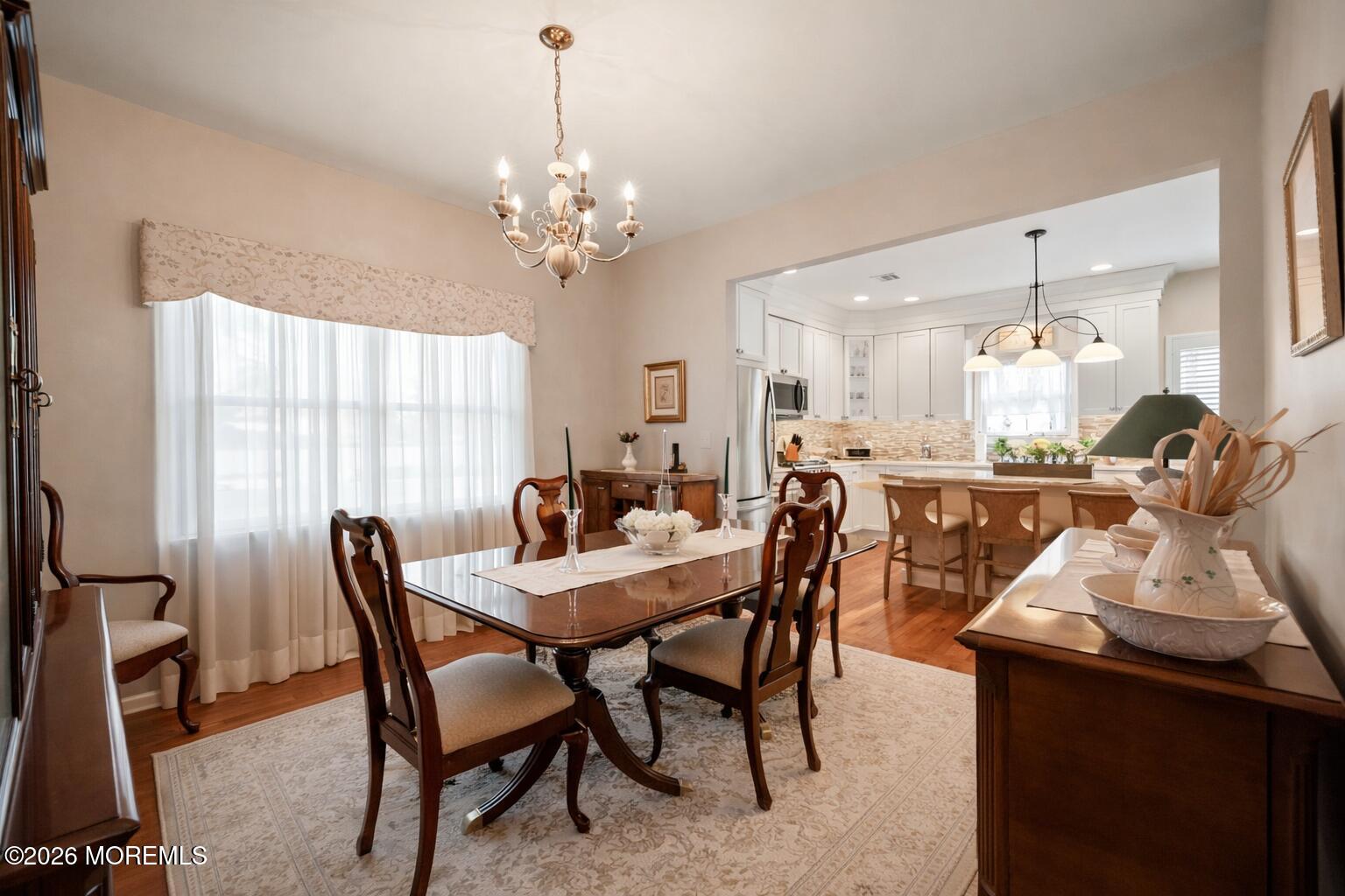 1726 M Street Wall, NJ 07719 - Photo 20 of 49 a view of a dining room with furniture and chandelier