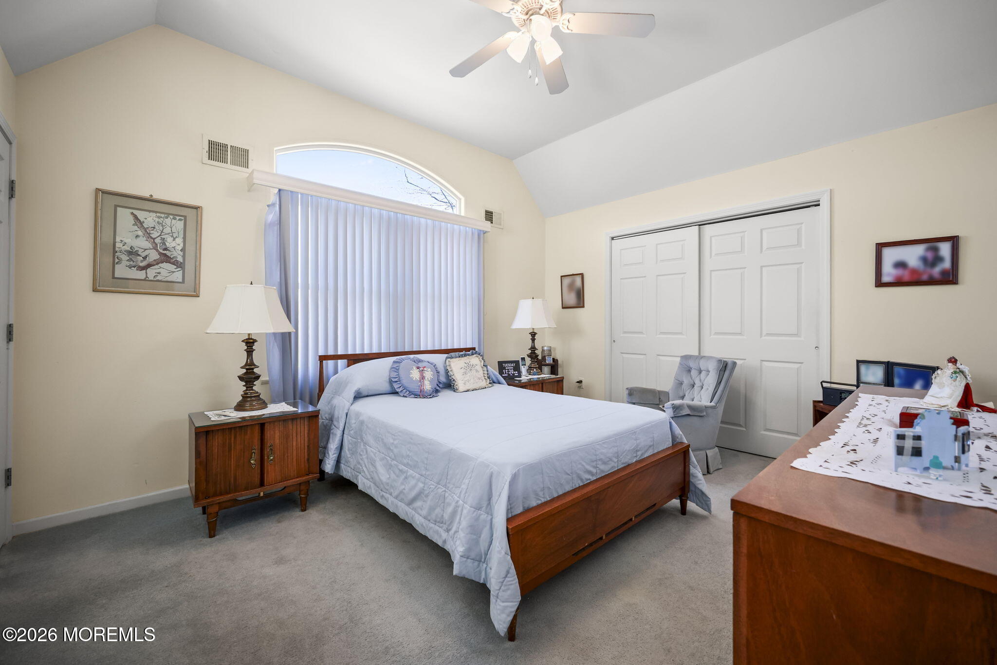 1726 M Street Wall, NJ 07719 - Photo 21 of 49 a bedroom with a bed and a chandelier