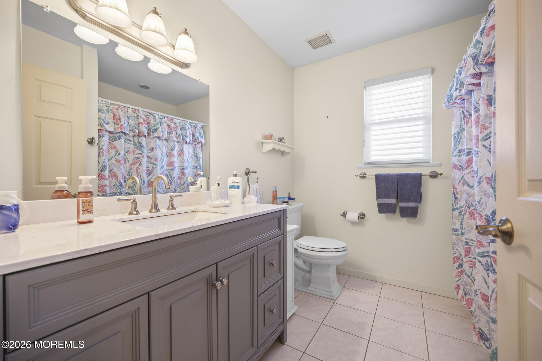 1726 M Street Wall, NJ 07719 - Photo 26 of 49 a bathroom with a double vanity sink mirror and toilet