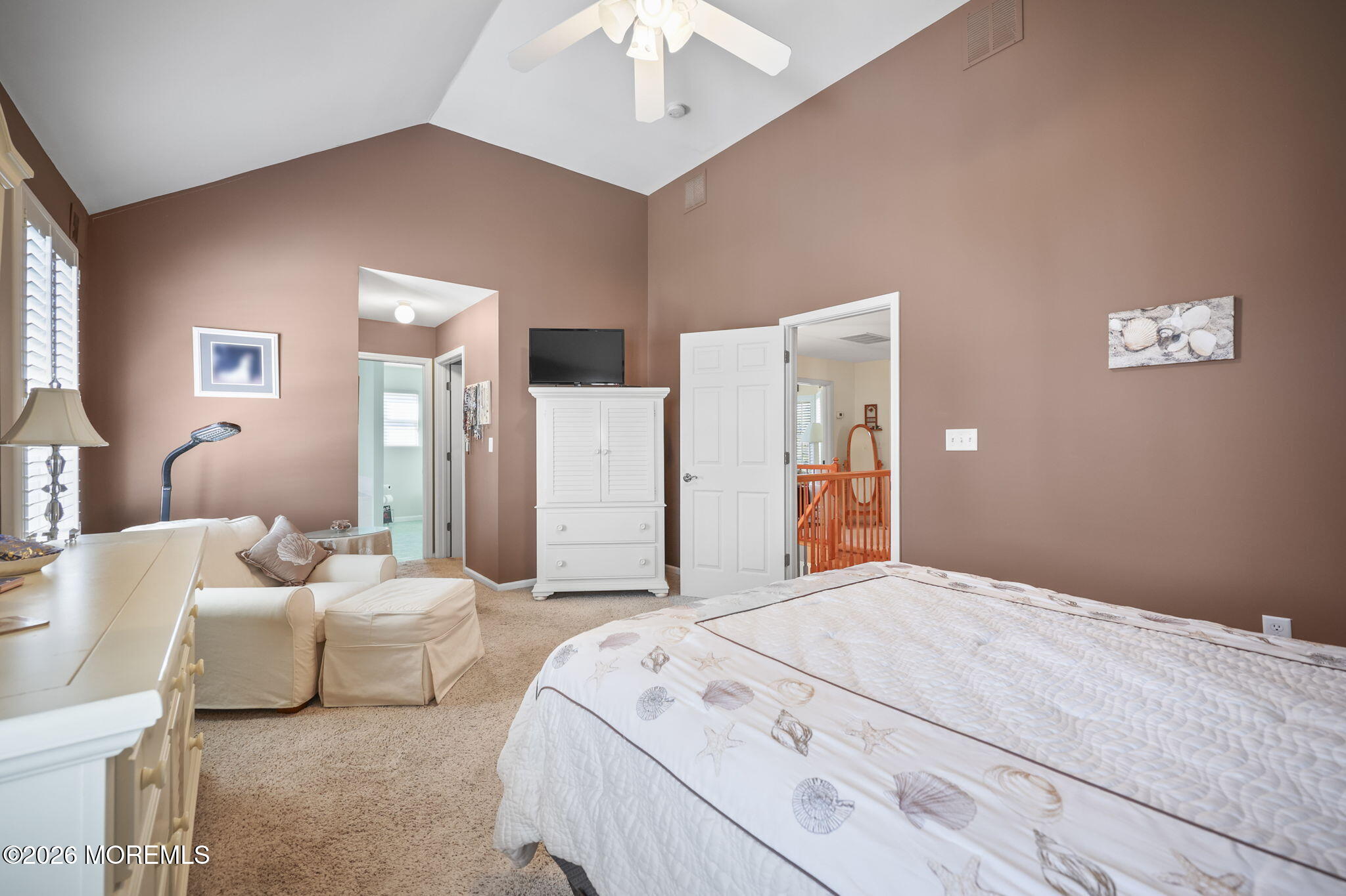 1726 M Street Wall, NJ 07719 - Photo 29 of 49 a bedroom with a bed and a chandelier