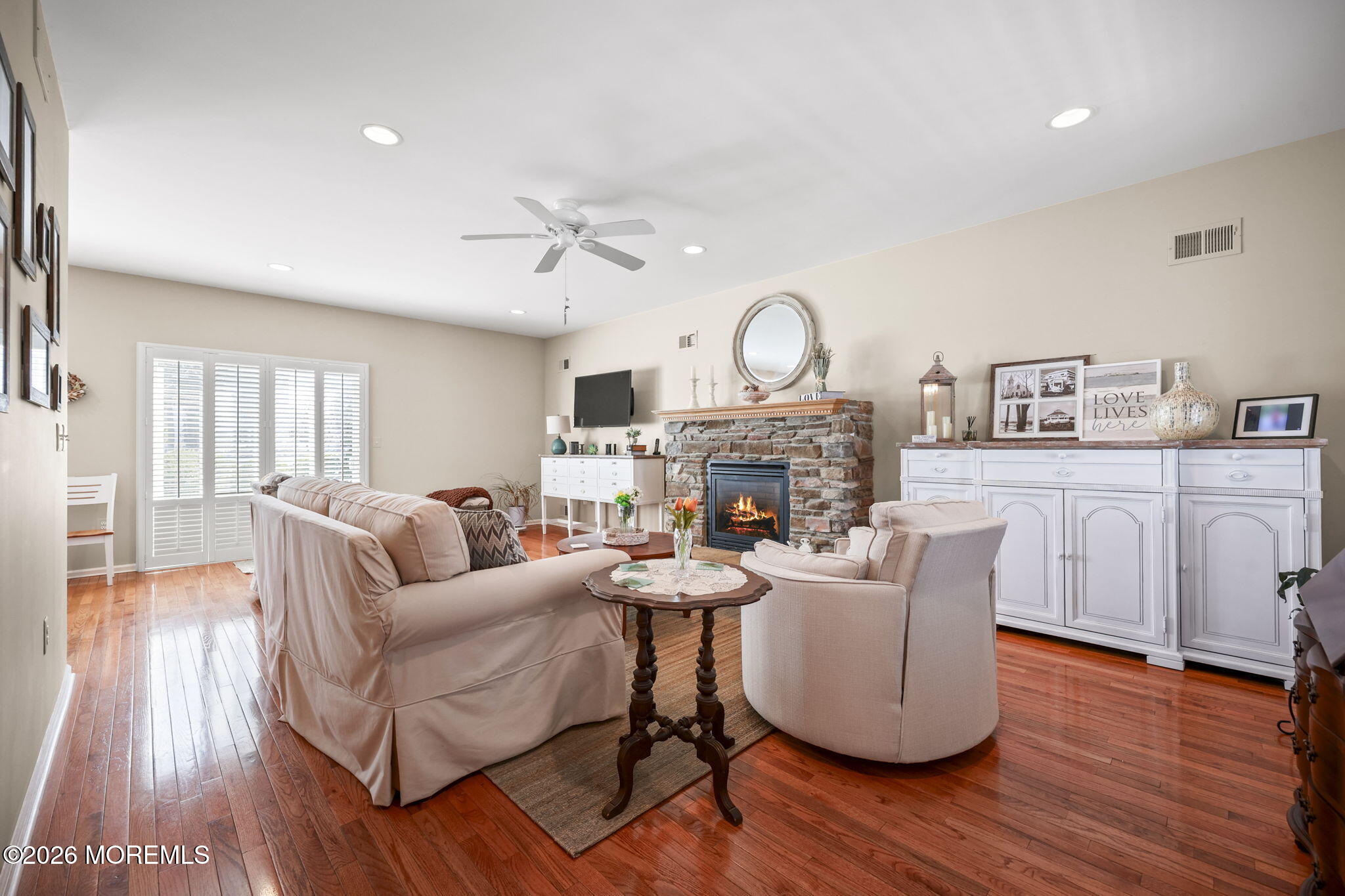 1726 M Street Wall, NJ 07719 - Photo 3 of 49 a living room with furniture a fireplace and wooden floor