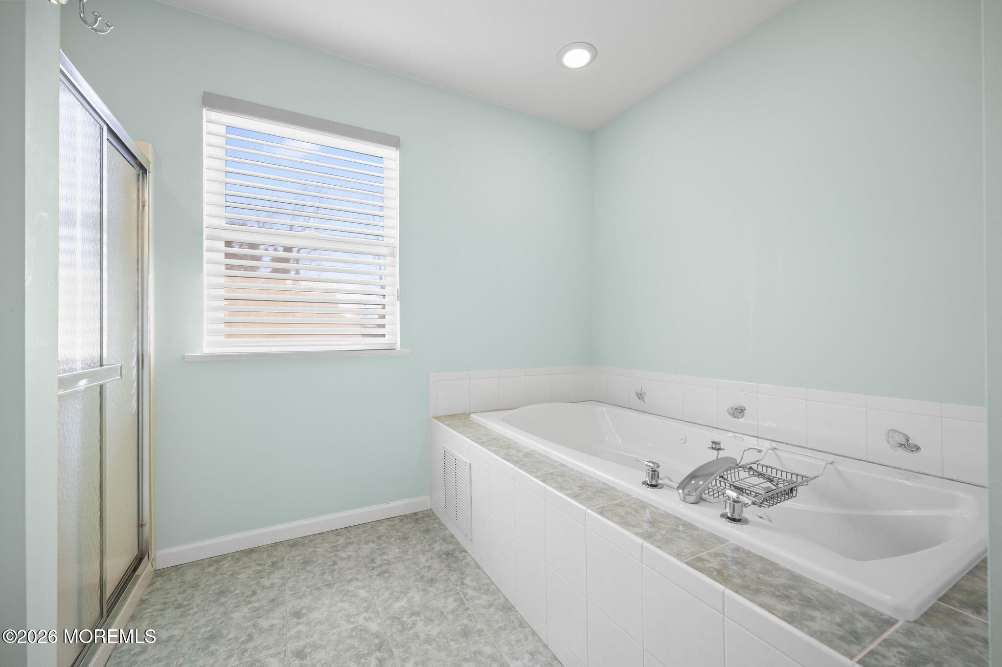1726 M Street Wall, NJ 07719 - Photo 33 of 49 a bath tub sitting in a bathroom next to a window