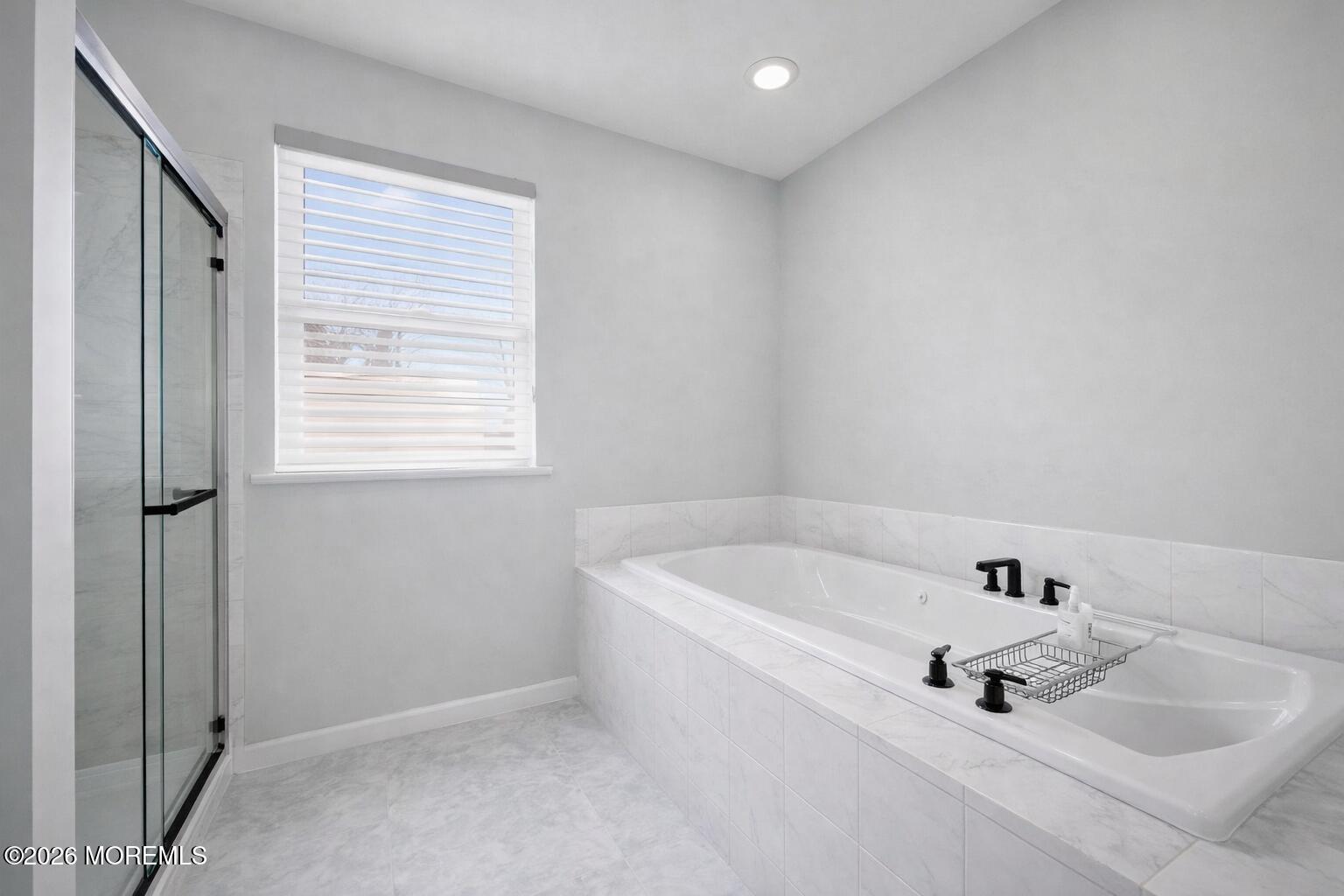 1726 M Street Wall, NJ 07719 - Photo 34 of 49 a white bath tub sitting in a bathroom