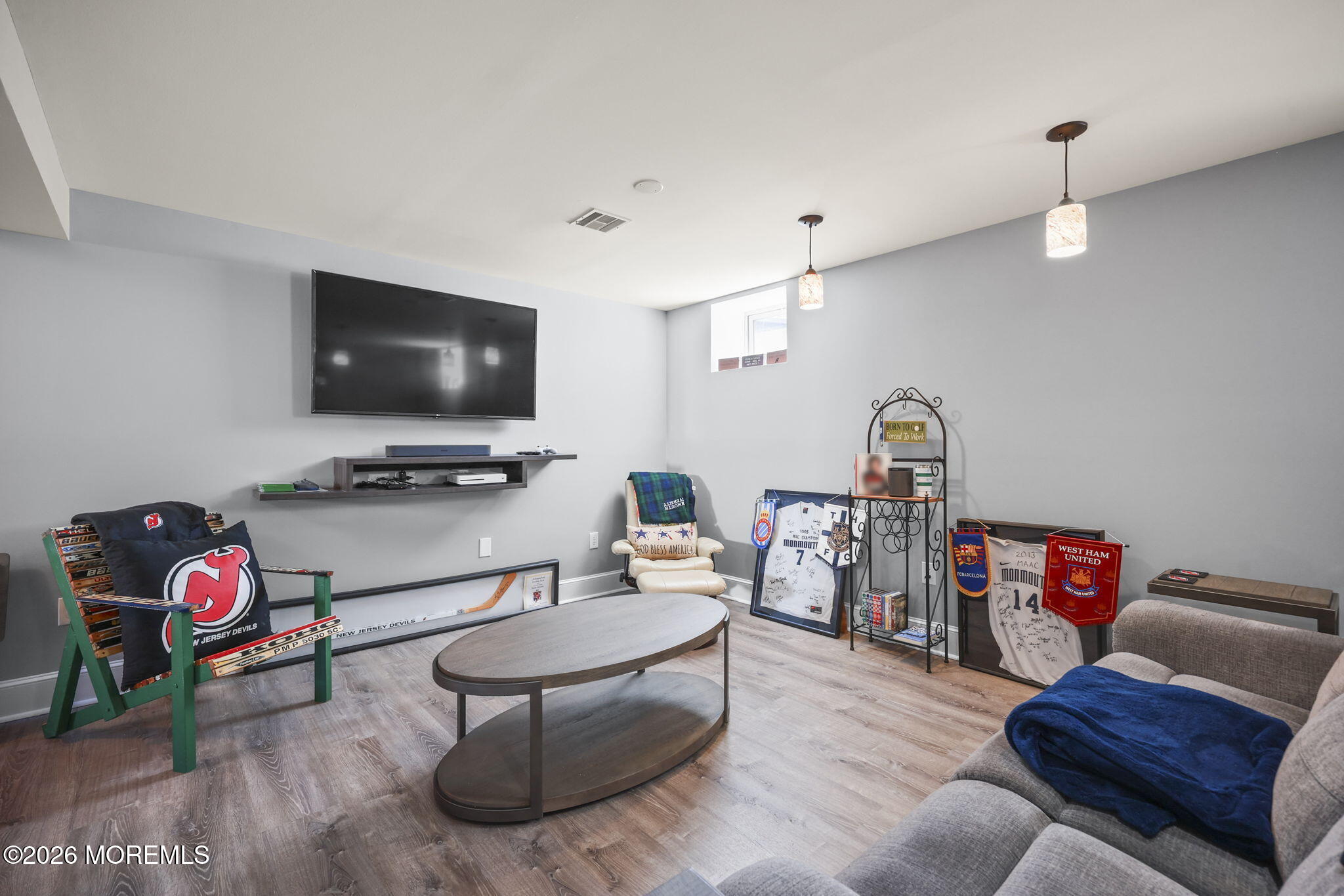1726 M Street Wall, NJ 07719 - Photo 37 of 49 a living room with furniture and a flat screen tv
