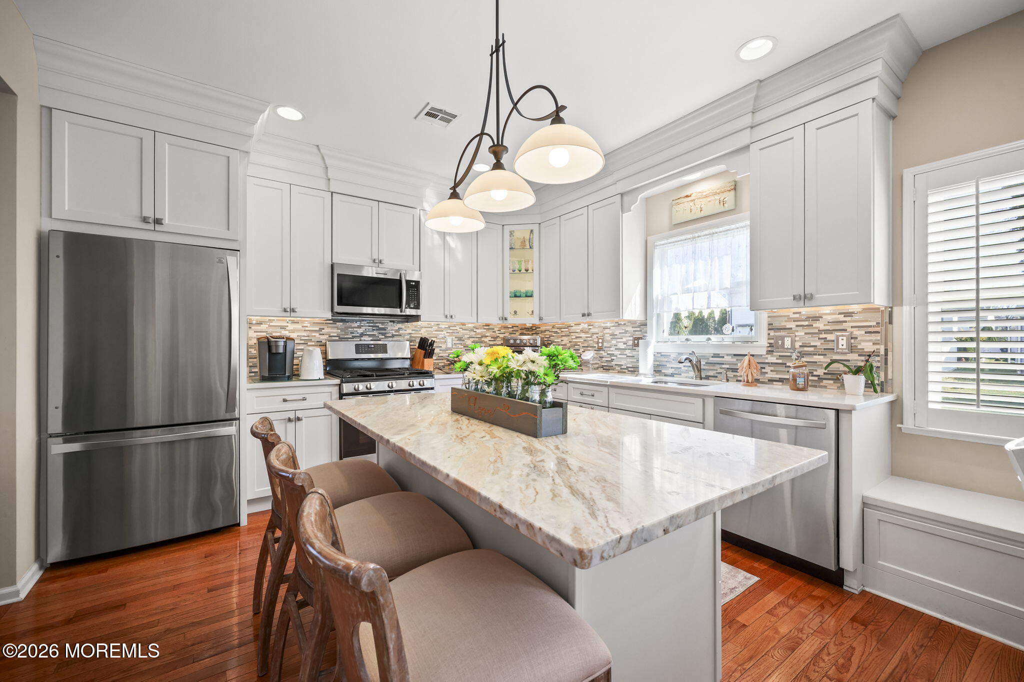 1726 M Street Wall, NJ 07719 - Photo 4 of 49 a kitchen with stainless steel appliances granite countertop a stove refrigerator and microwave