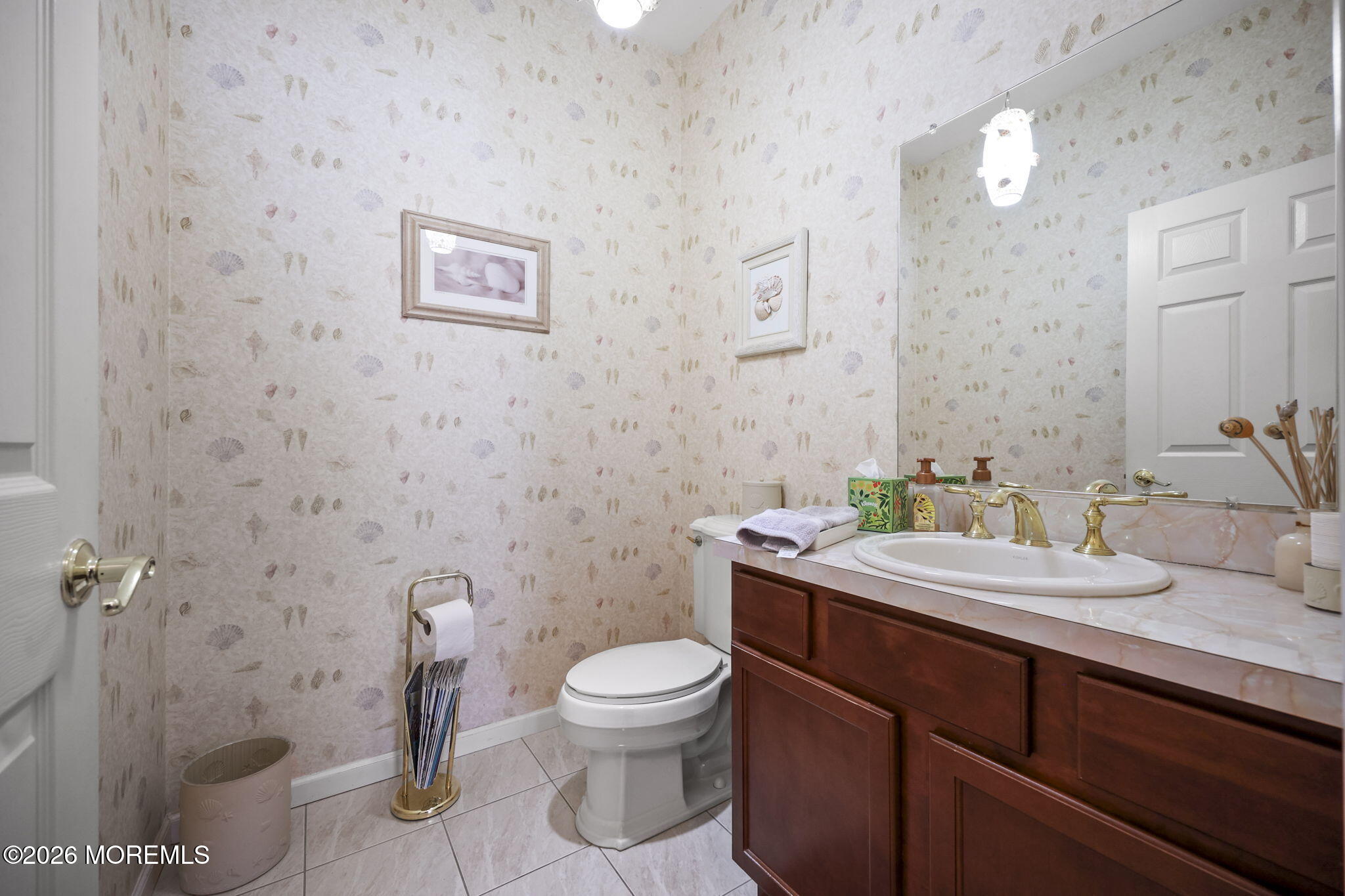 1726 M Street Wall, NJ 07719 - Photo 7 of 49 a bathroom with a granite countertop toilet a sink and a mirror