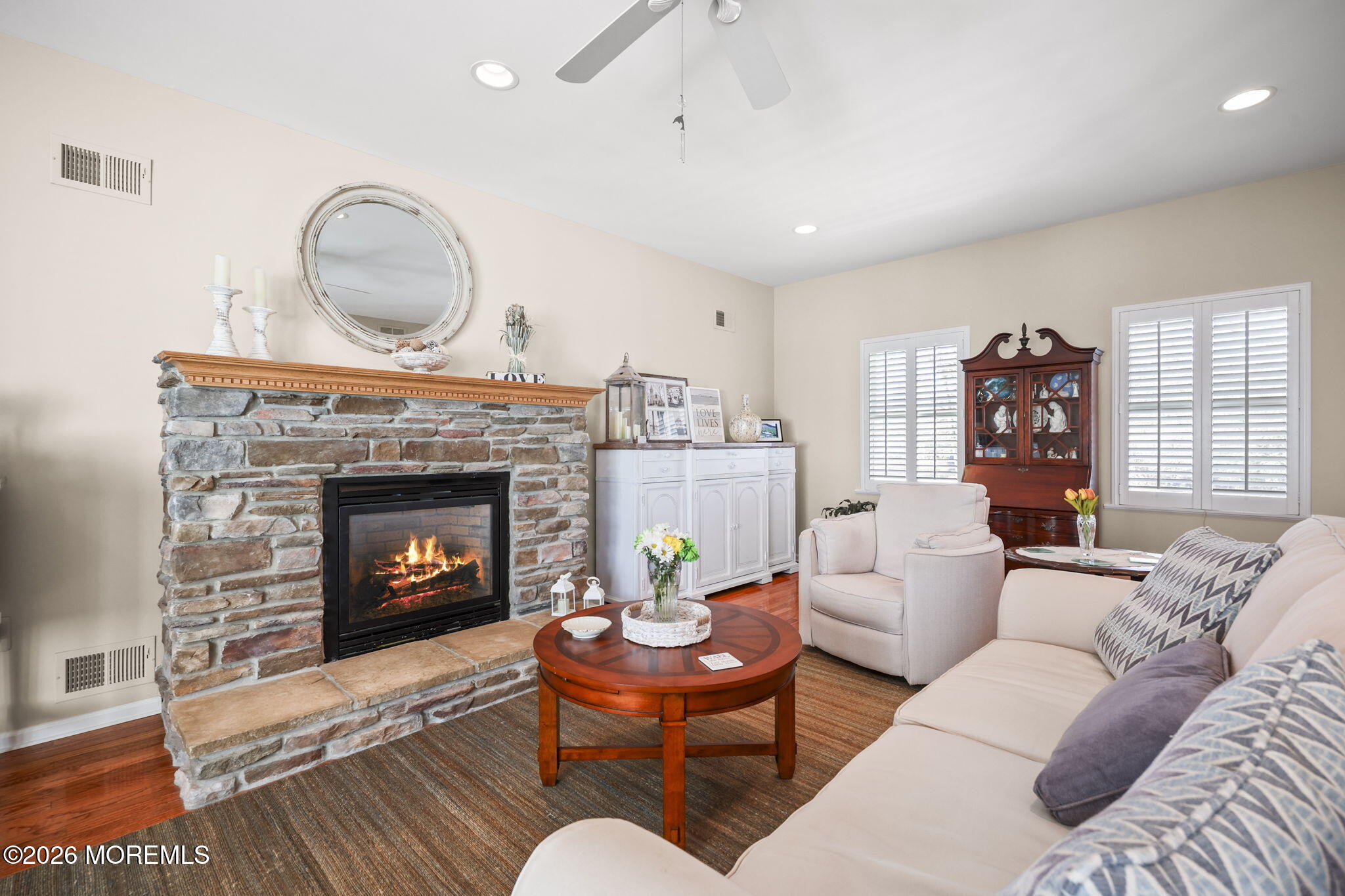 1726 M Street Wall, NJ 07719 - Photo 9 of 49 a living room with furniture a fireplace and window