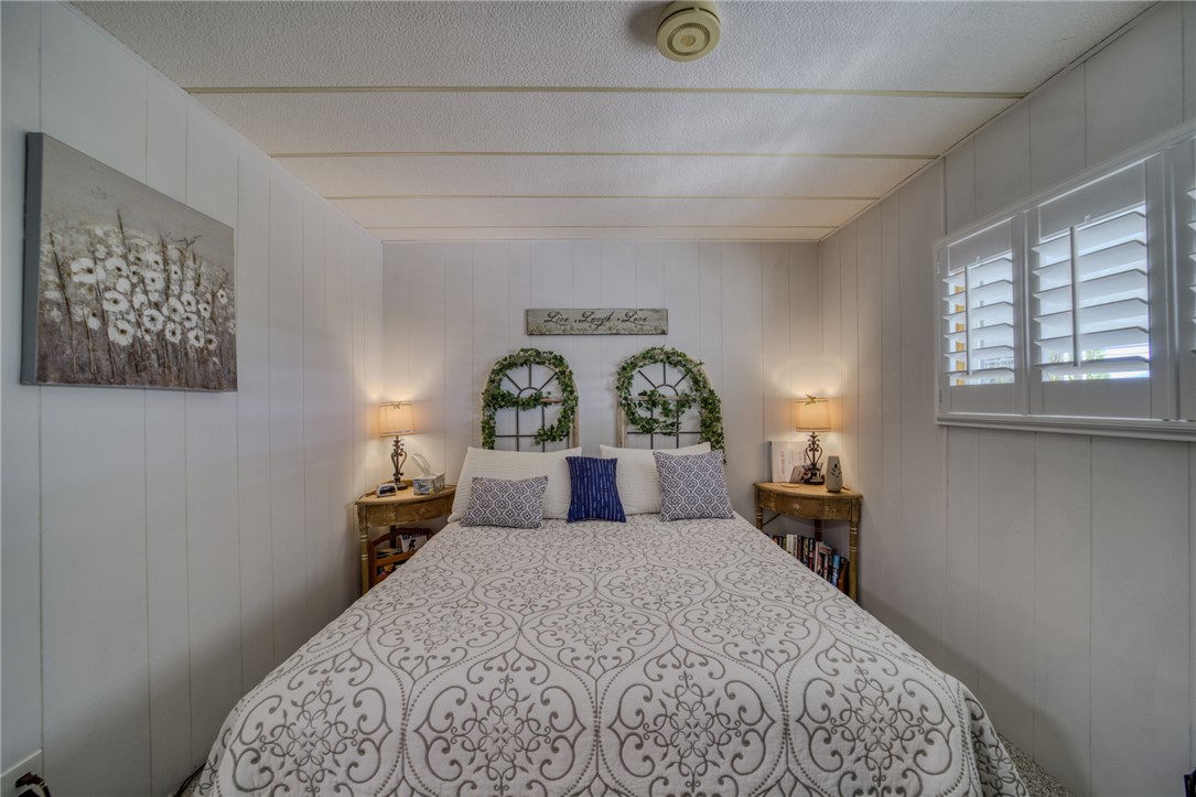 4826 Powell Lake Road Topock, AZ 86436 - Photo 22 of 58 a bedroom with a large bed and a window