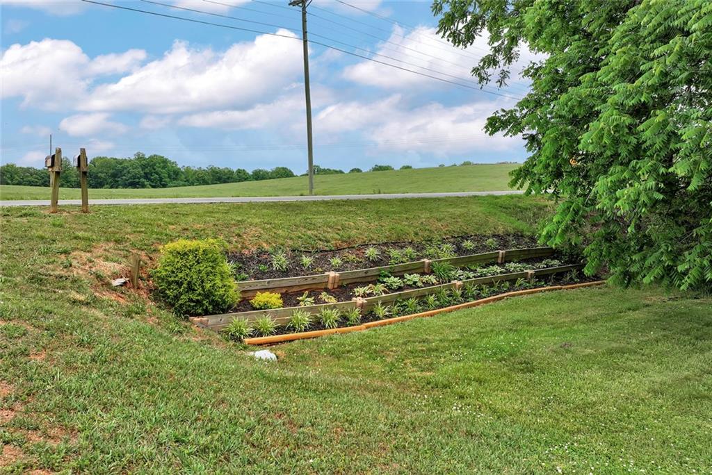 1044 Lothridge Road Cleveland, GA 30528 - Photo 37 of 40 a view of a garden with a slide