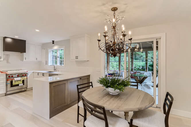 4 Penny Lane Edgartown, MA 02539 - Photo 11 of 60 a view of a dining room with furniture a chandelier and window
