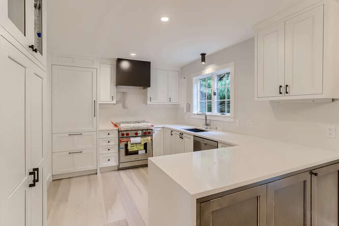 4 Penny Lane Edgartown, MA 02539 - Photo 12 of 60 a kitchen that has a sink and a stove in it