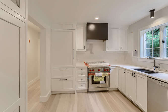 4 Penny Lane Edgartown, MA 02539 - Photo 18 of 60 a kitchen with cabinets a sink and appliances