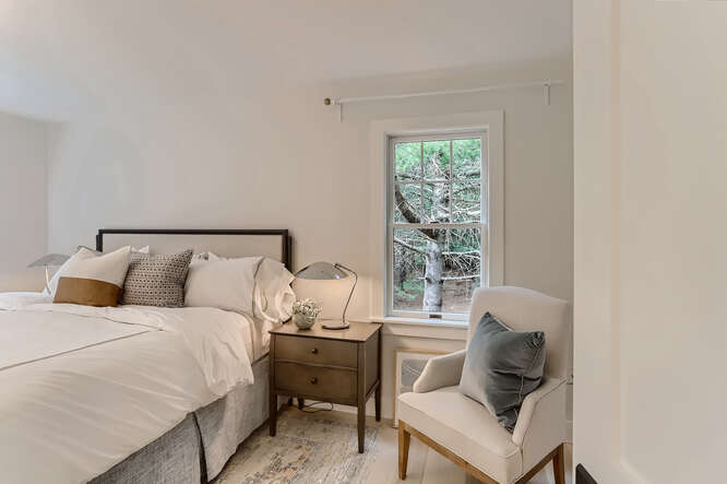 4 Penny Lane Edgartown, MA 02539 - Photo 25 of 60 a bed room with a bed and a chair