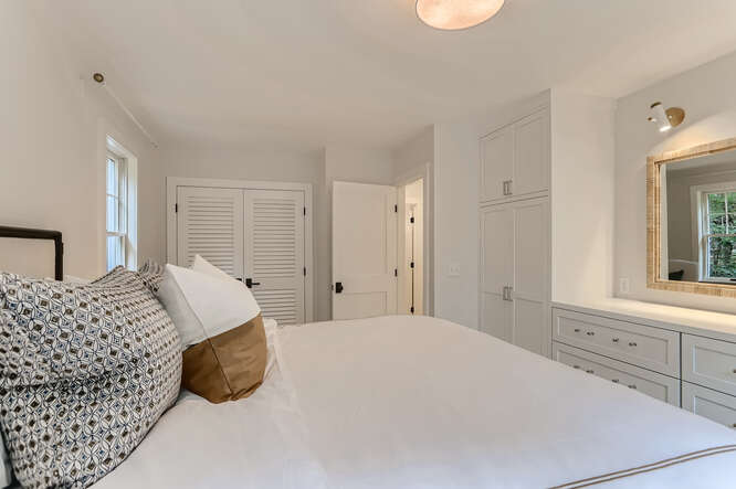4 Penny Lane Edgartown, MA 02539 - Photo 27 of 60 a bedroom with a bed and a window
