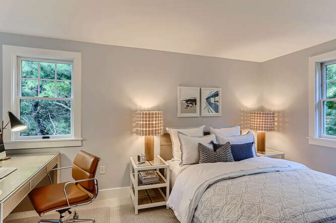 4 Penny Lane Edgartown, MA 02539 - Photo 34 of 60 a bed room with a bed and two chair