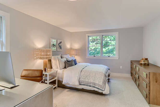 4 Penny Lane Edgartown, MA 02539 - Photo 37 of 60 a bedroom with a bed and a table in it