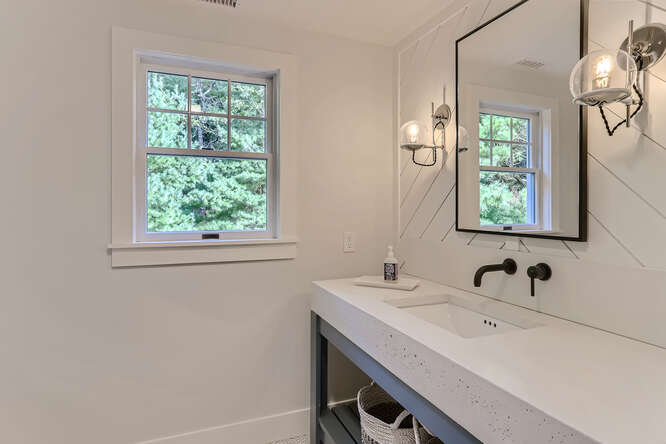4 Penny Lane Edgartown, MA 02539 - Photo 38 of 60 a bathroom with a sink and a mirror