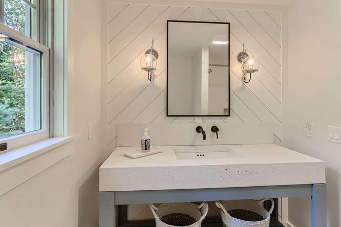4 Penny Lane Edgartown, MA 02539 - Photo 39 of 60 a bathroom with a sink and a mirror