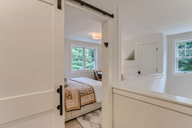 4 Penny Lane Edgartown, MA 02539 - Photo 43 of 60 a bedroom with a bed and a window