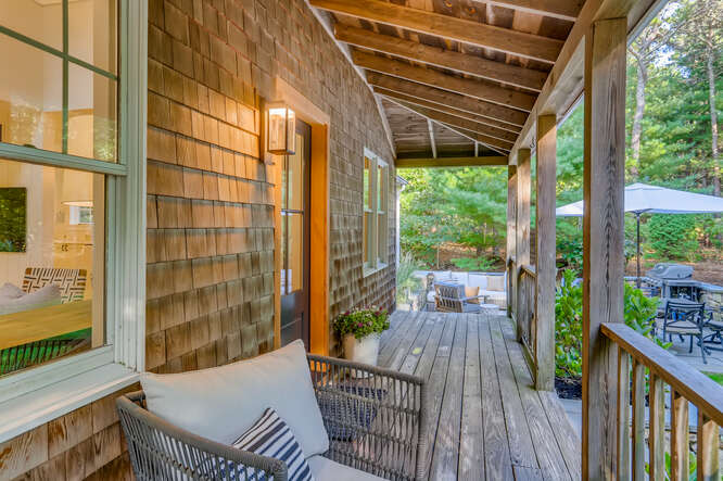 4 Penny Lane Edgartown, MA 02539 - Photo 47 of 60 a balcony with furniture and wooden floor